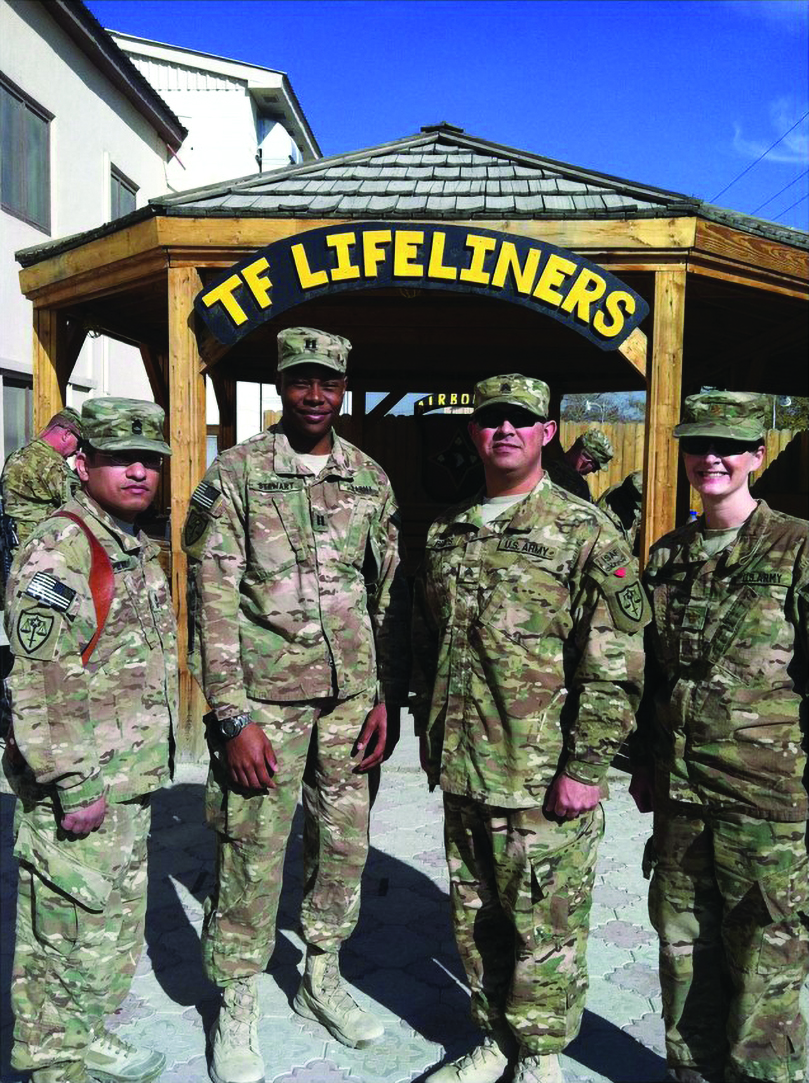 Bagram, Afghanistan (2013): Promotion Ceremony for
            SGT Roberto Ramos (Bagram Field Office paralegal).
            Pictured left to right: MSG Aaron Perez (NCOIC), CPT Keith
            Stewart (DC), SGT Roberto Ramos (paralegal NCO), and
            MAJ Mary Meek (SDC).